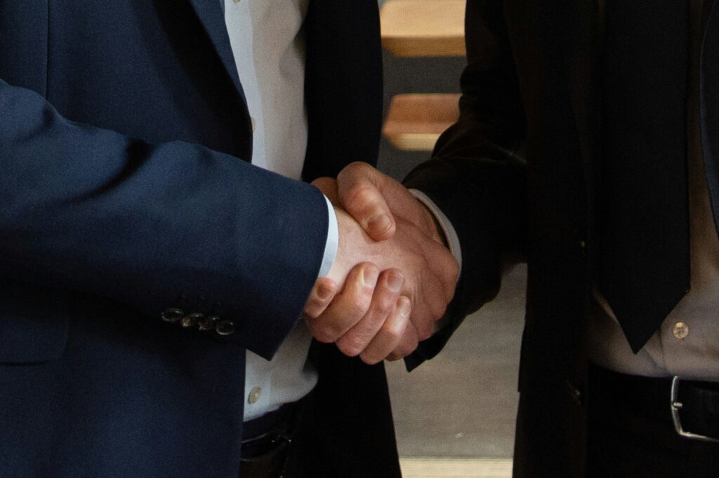Two business leaders shaking hands